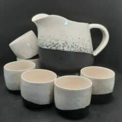 Black and white set of cups and jug by JAE Ceramics. An exhibitor at Craftworks.