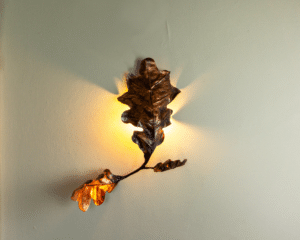 Wall mounted forged metal light by Willow Bloomfield. An exhibitor at Craftworks.