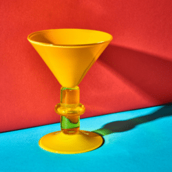 Yellow wine glass made by Gather Glass, an exhibitor of Craftworks
